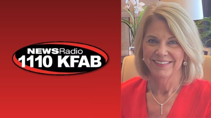 A photo of Jean Stothert and the 1110 KFAB logo